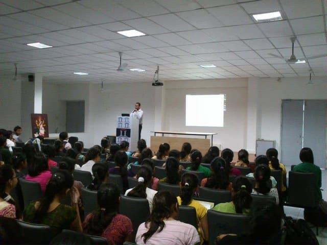 Workshop participants receiving one-on-one guidance from a trainer.
